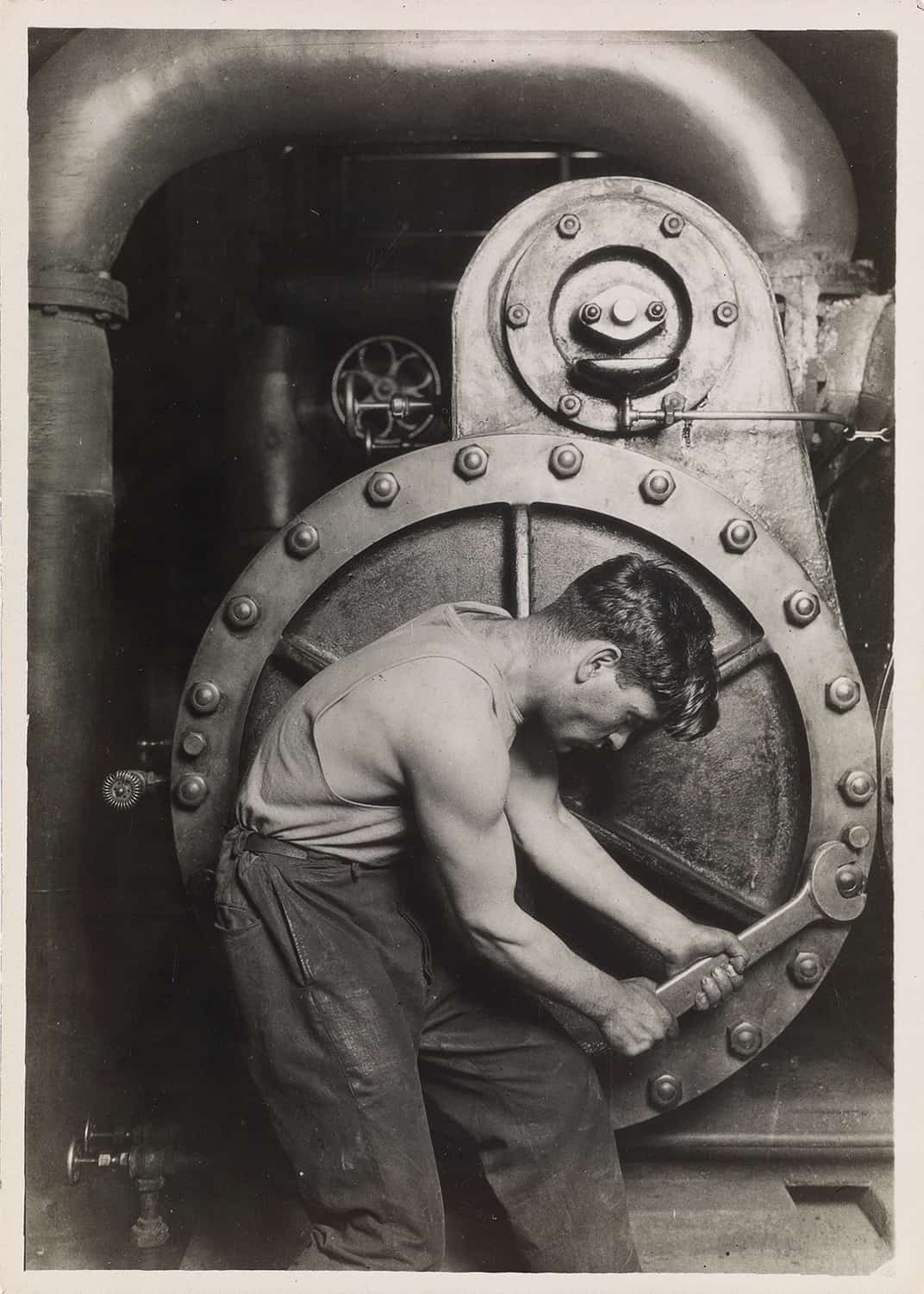 Lewis Hine - Power house mechanic working on steam pump